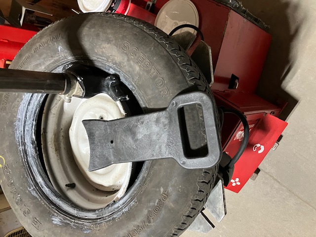Zeppa tool laying on top of tire and wheel showing its size.